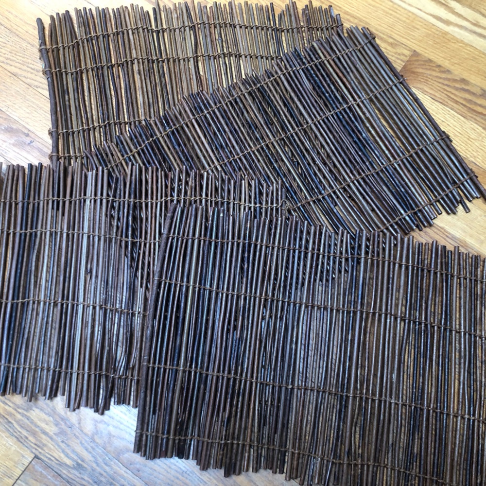 Used and great condition set of four twig placemats.